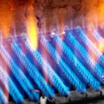 Close-up of blue flames from a gas burner