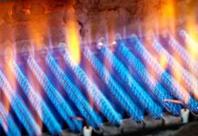 Close-up of blue flames from a gas burner