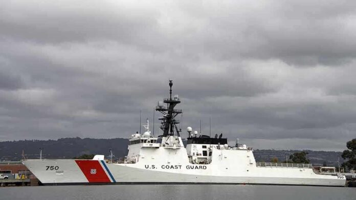 shutterstock_229880047.jpg A U.S. Coast Guard ship docked under cloudy skies
