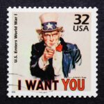 Vintage stamp featuring Uncle Sam pointing with the text I WANT YOU
