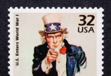Vintage stamp featuring Uncle Sam pointing with the text I WANT YOU
