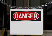 A warning sign displaying the word DANGER in bold red letters