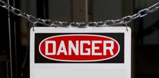 A warning sign displaying the word DANGER in bold red letters