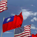 Taiwan Arms Deal In Limbo American and Taiwanese flags waving in the sky.