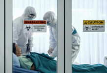 DEADLY Meningitis Cluster Hidden — WHY? Healthcare workers in protective gear in quarantine room.