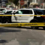 Public Safety Concerns Rise Amid Truck Disturbance Police tape blocking street with patrol cars.