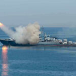 Military Moves Shake Strait Shipping Stability Warship firing missile in the sea.