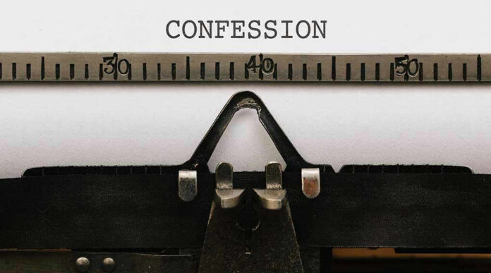 579321010 Typewriter with CONFESSION on paper.