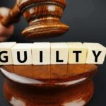 Top Fashion Co-Founder CONVICTED of SHOCKING CRIME A gavel above wooden blocks spelling 'GUILTY'