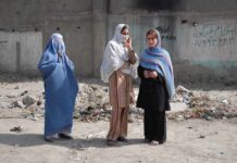 Pakistan Court SHOCKER: Child Marriage Upheld! Three women in traditional attire standing in an urban setting with debris in the background