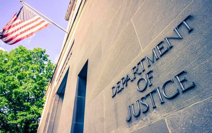 shutterstock_1384089728-2- Exterior view of the Department of Justice building with an American flag