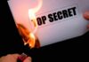Hunter Drops BOMBSHELL: Dark SECRETS REVEALED A hand holding a lighter igniting a paper labeled TOP SECRET as it catches fire
