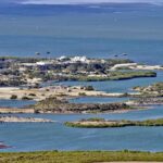 IMMINENT Ocean COLLAPSE Fear Sparks Radical DAM PLAN Aerial view of a coastal landscape featuring waterways and islands