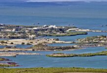 Aerial view of a coastal landscape featuring waterways and islands