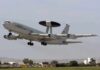 NATO AWACS aircraft taking off from an airfield
