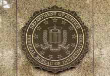 FBI Busts Alleged ISIS Plot FBI seal on a marble wall.