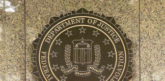 FBI seal on a marble wall.