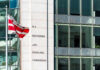 Major Sanctions Strike Hits Foreign Financial Network U.S. Securities and Exchange Commission building and flag.