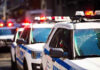 NBA Finals Game Brings NYC Security Perimeter Police cars with flashing lights in line formation.
