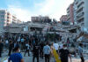 A Miracle: Baby Pulled Alive From Earthquake Rubble People at a collapsed building after an earthquake.