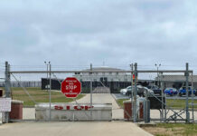 Navy Horror: Killer Warned, Nothing Stopped Him Chain-link fence with Restricted Area Stop No Photography sign.