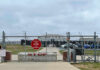 Missing Kids Promise, Broken System Chain-link fence with Restricted Area Stop No Photography sign.