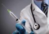 The Catch: Routine Test Reveals Hidden Iron Disorder A doctor holding a syringe with a stethoscope around their neck
