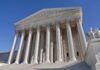 Audit Finds $1.5M in Duplicate Medicare Payments The Supreme Court building featuring grand columns and statues under a clear blue sky
