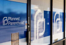 Paid-For Contraceptives Headed for Incineration Planned Parenthood office entrance with logo and signs.