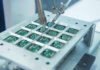 A Chip Giant Just Made a €5 Billion Bet on AI Robotic arm assembling electronic circuit boards in production.