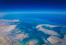 China’s Next Power Move May Not Require a Single Shot Aerial view of coastline and ocean.
