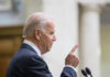 Court Clears Release of Biden’s Memoir Tapes Man in suit pointing while speaking at podium.