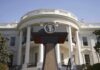New White House Fence Would Allow Officials Press podium with presidential seal in front of the White House