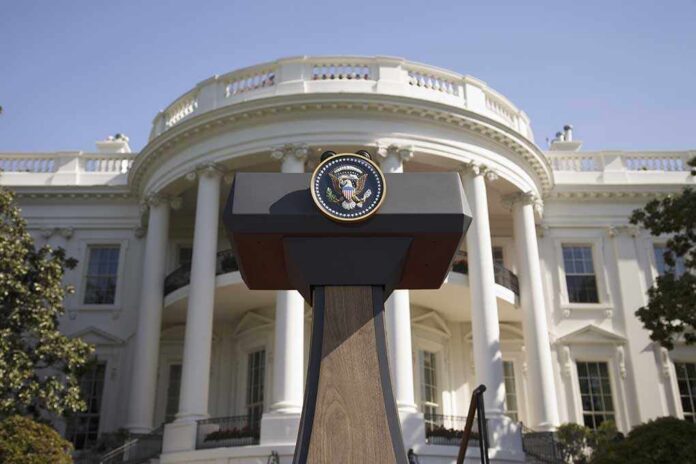 Press podium with presidential seal in front of the White House