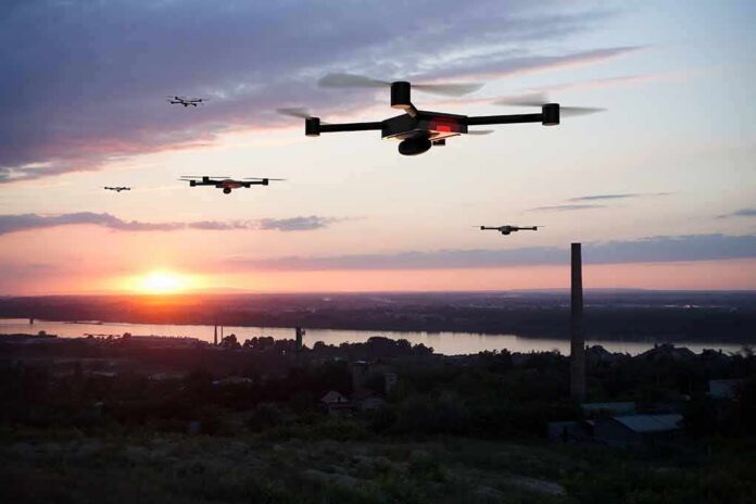 shutterstock_1143966755 Drones flying over a river landscape at sunset
