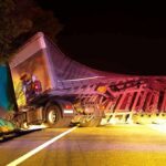 Trooper Killed: A Death Fuels Border Debate An overturned truck on the side of the road at night with emergency lights