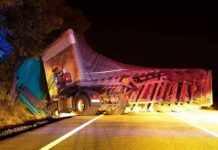 Trooper Killed: A Death Fuels Border Debate An overturned truck on the side of the road at night with emergency lights