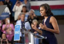 From “Nazis” Claim To Public Apology A female speaker passionately addressing a crowd at a campaign event