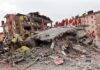 Families Lost Everything. One Charity Says It’s Already Served Rescue workers in orange uniforms on a collapsed building site after an earthquake