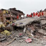 Families Lost Everything. One Charity Says It’s Already Served Rescue workers in orange uniforms on a collapsed building site after an earthquake
