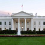 Authorities Allege White House Fight Night The White House with a fountain in the foreground and an American flag flying