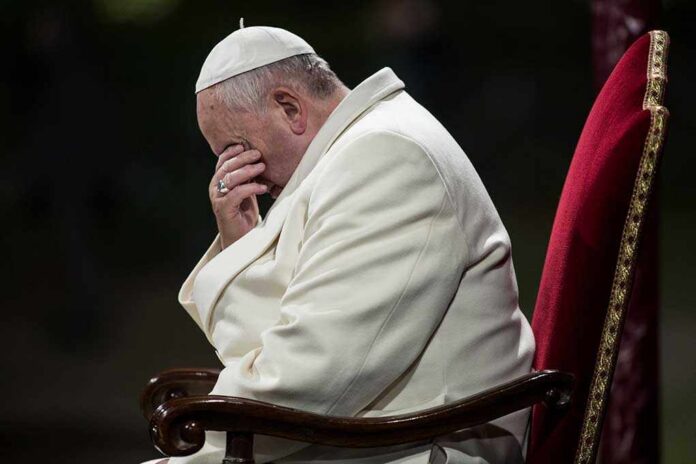 Rome,,Italy,-,April,18,,2014:,Pope,Francis,Celebrates,The Pope sitting with his head bowed and hand covering his face