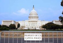 The Election Claim That Stops Short of Vote Tampering View of the U.S. Capitol building with a security barrier in front
