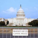 Unverified Claims Spark Online Speculation View of the U.S. Capitol building with a security barrier in front