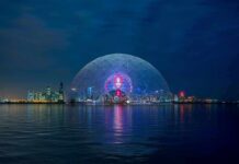 World Cup Halftime Show Sparks Fan Revolt Geodesic dome illuminated at night by the waterfront