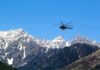 Tourist Park PANIC: Aircraft Falls From Sky Helicopter flying over snow-capped mountain range