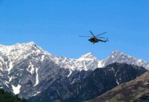 Tourist Park PANIC: Aircraft Falls From Sky Helicopter flying over snow-capped mountain range