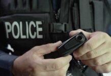 Washington Argued. Officers Went Into Deadly Encounters Police officer holding a body camera