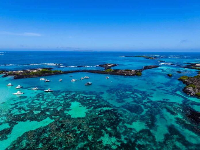 shutterstock_696803833 Boats anchored in turquoise lagoon with rocky islets