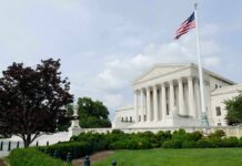 Deadly Attack: One Word Sparks National Debate The U.S. Supreme Court building with an American flag and landscaped grounds